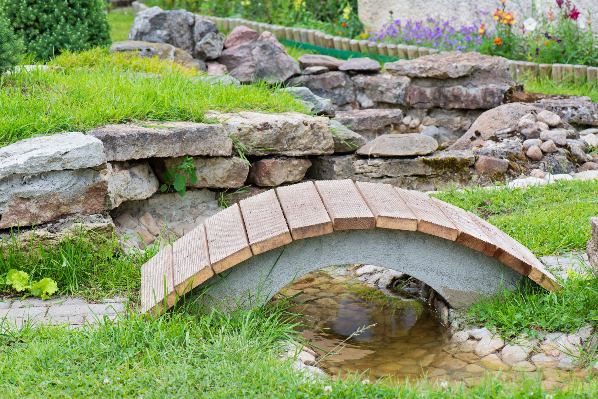 Custom landscaping and stone garden feature by PNW Lawncare in Spokane, WA